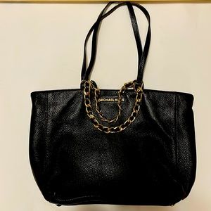 Gently used Michael Kors Black Tote,that is very clean on both sides,inside too.